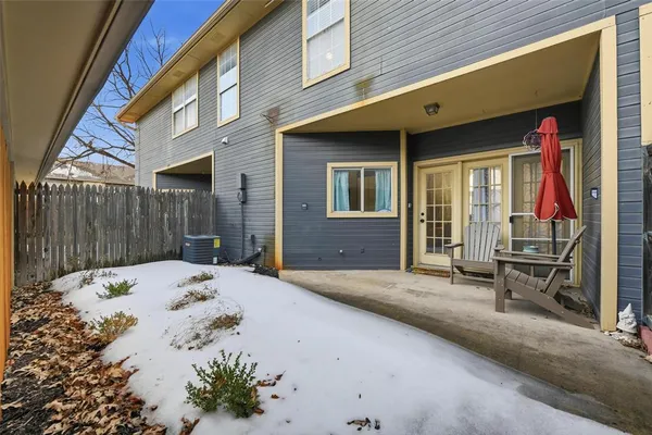 a view of a lounge chair in the patio of a building