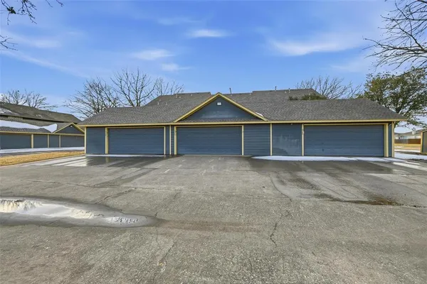 a front view of a house with a garage