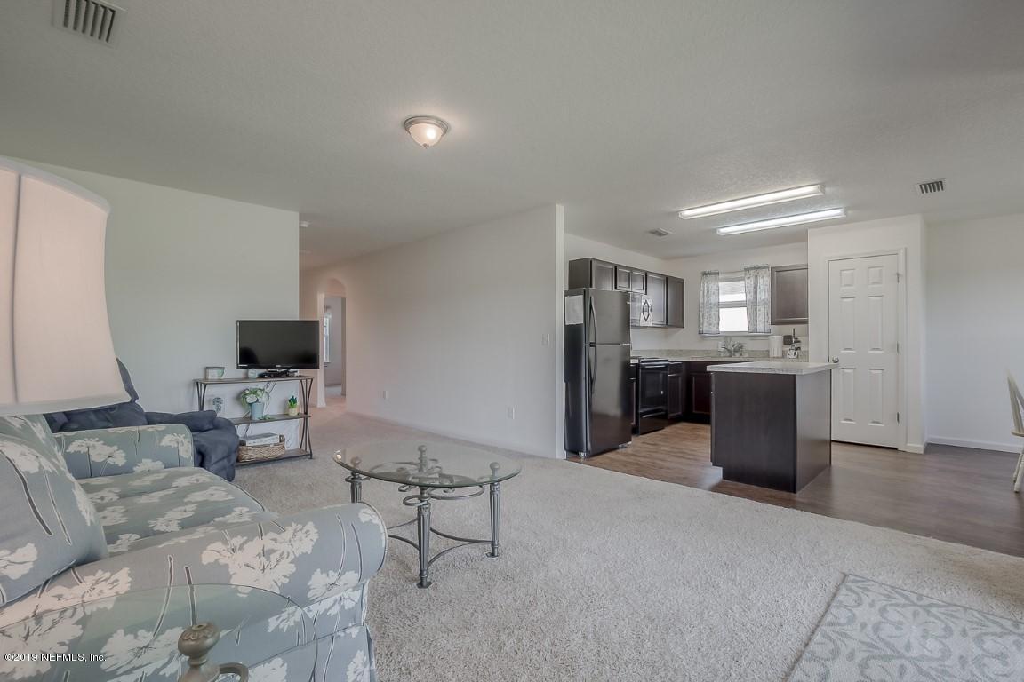 6245 Daylilly Road Macclenny, FL 32063 - Photo 7 of 34 Family room open to kitchen