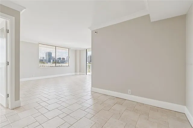 a kitchen with cabinets appliances a sink and a counter top space