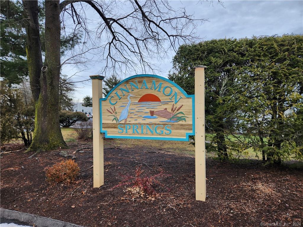 91 Cinnamon Spring, Unit 91 South Windsor, CT 06074 - Photo 1 of 1 a sign board with parking space