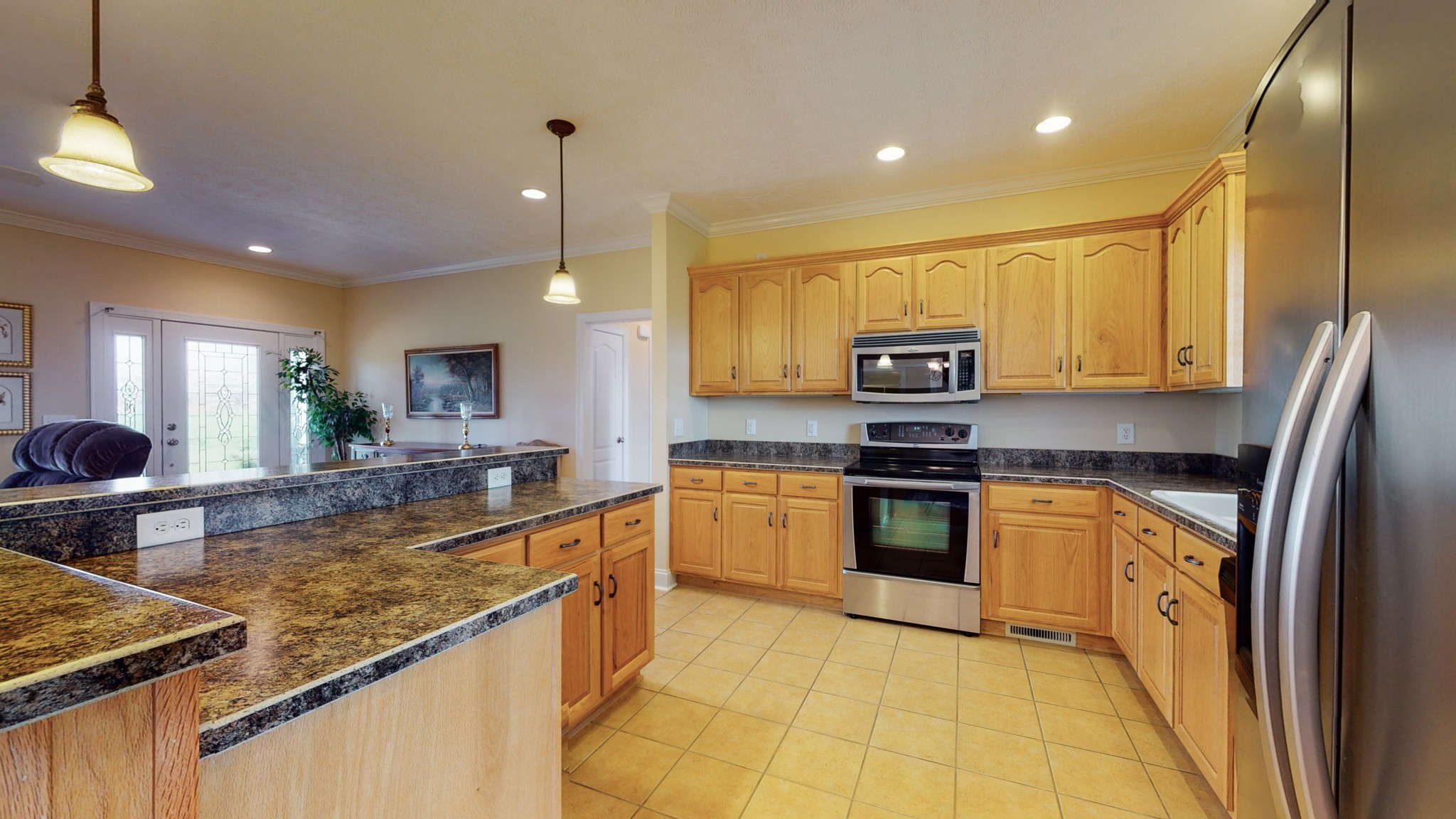2996 South Rutland Road Mount Juliet, TN 37122 - Photo 11 of 37 a kitchen with stainless steel appliances granite countertop a sink and a stove