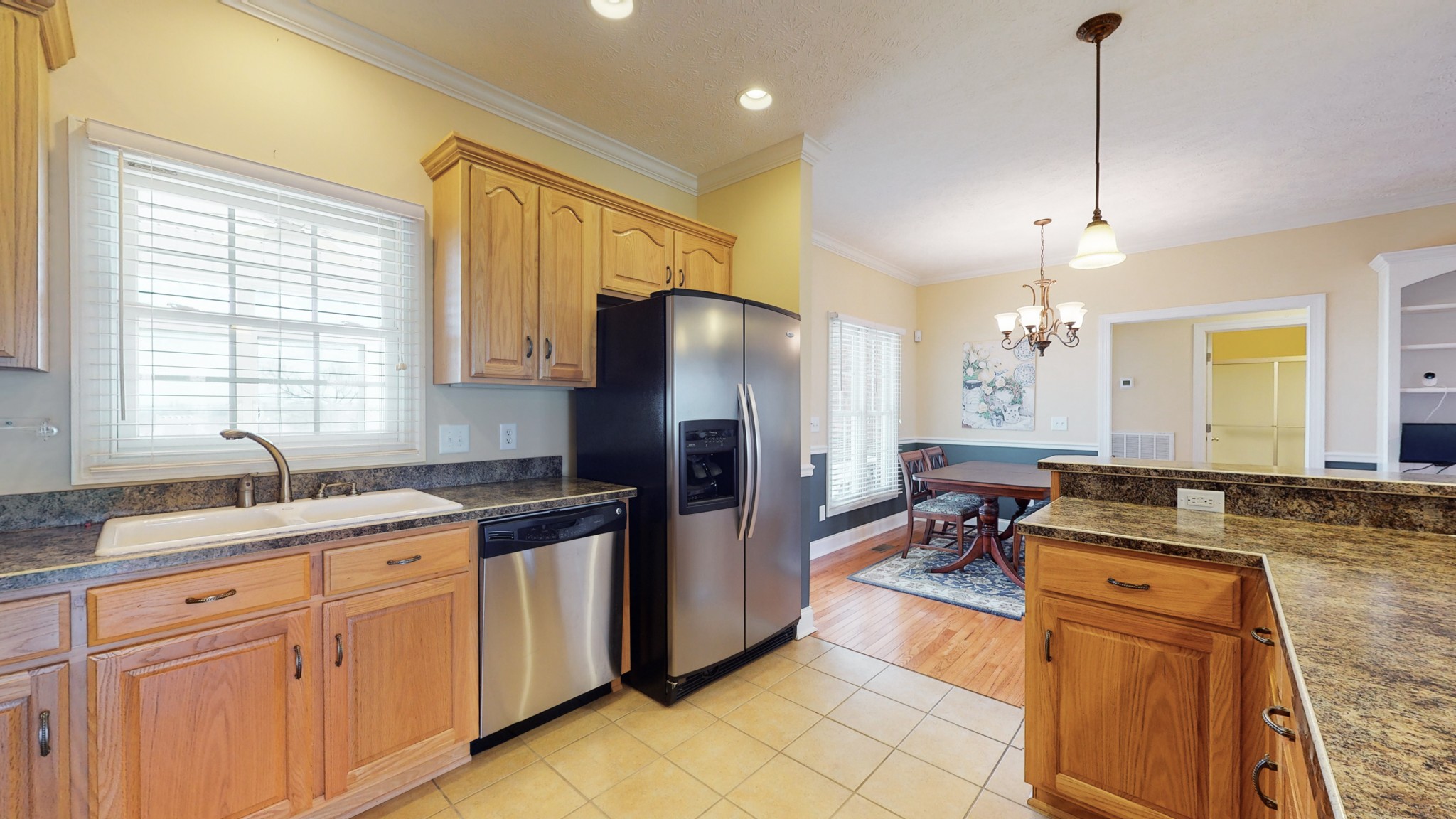 2996 South Rutland Road Mount Juliet, TN 37122 - Photo 12 of 37 a kitchen with stainless steel appliances granite countertop a sink stove and refrigerator