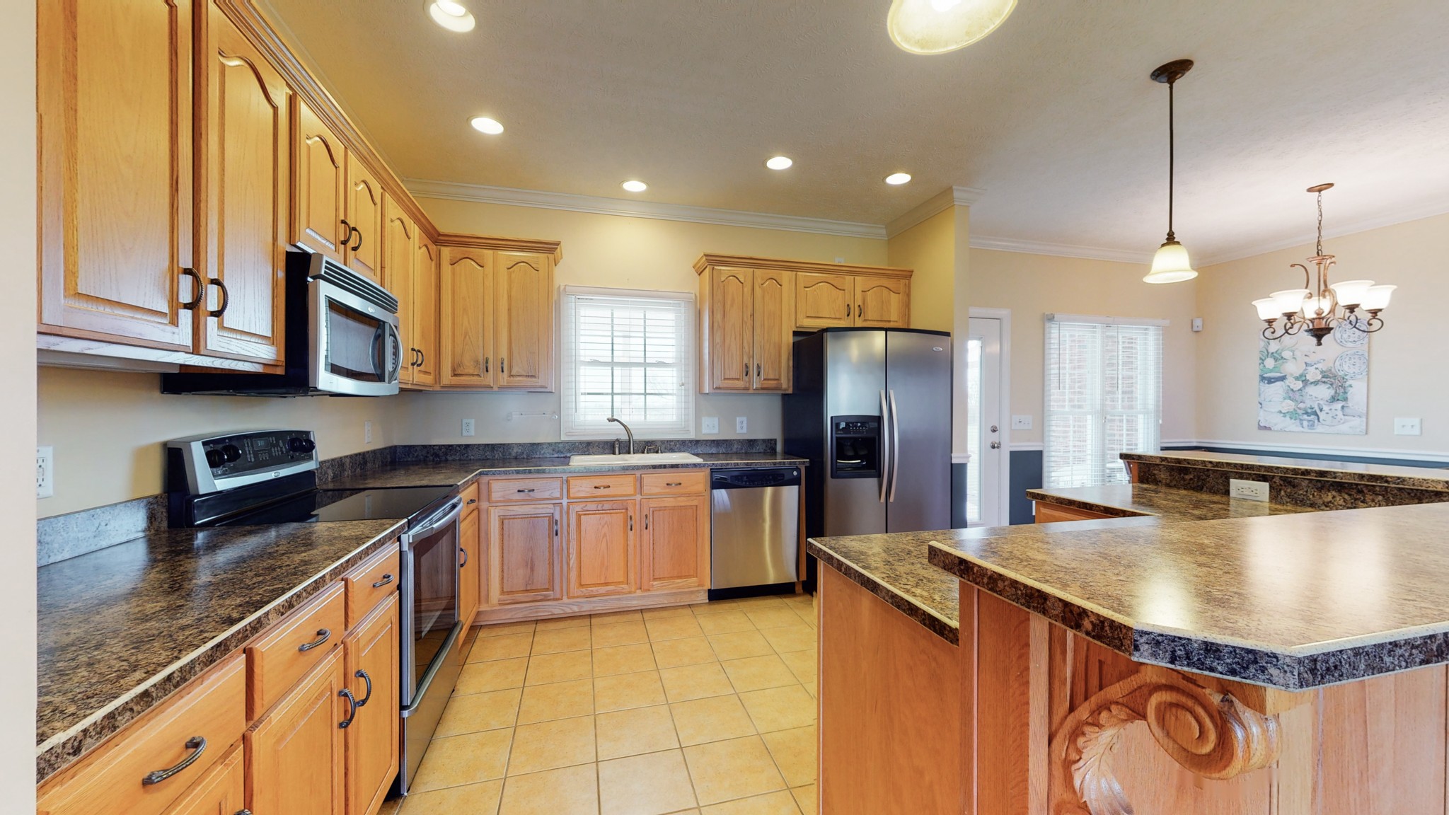 2996 South Rutland Road Mount Juliet, TN 37122 - Photo 13 of 37 a kitchen with stainless steel appliances granite countertop a sink a stove and a refrigerator