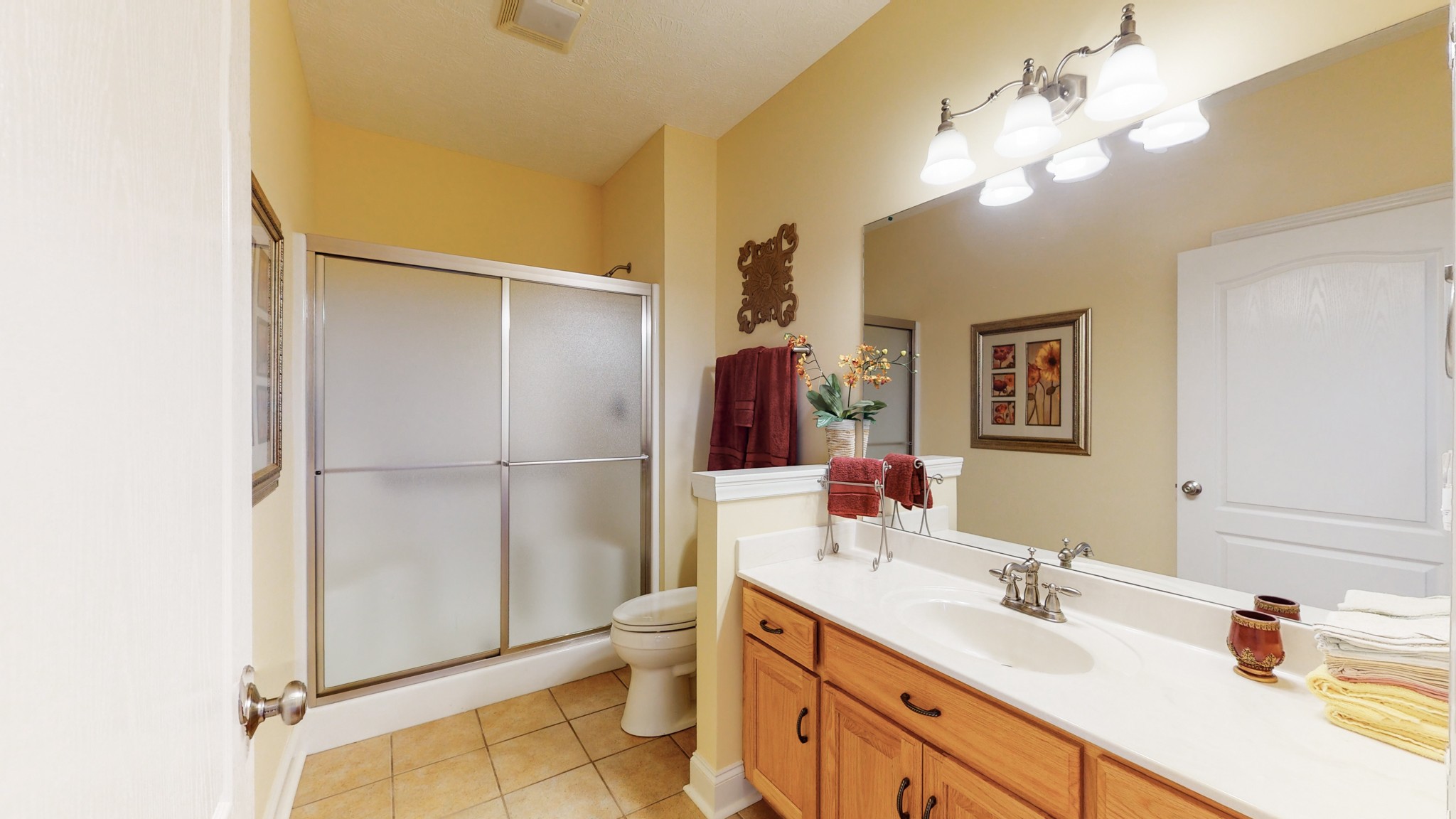 2996 South Rutland Road Mount Juliet, TN 37122 - Photo 22 of 37 a bathroom with a double vanity sink mirror and shower