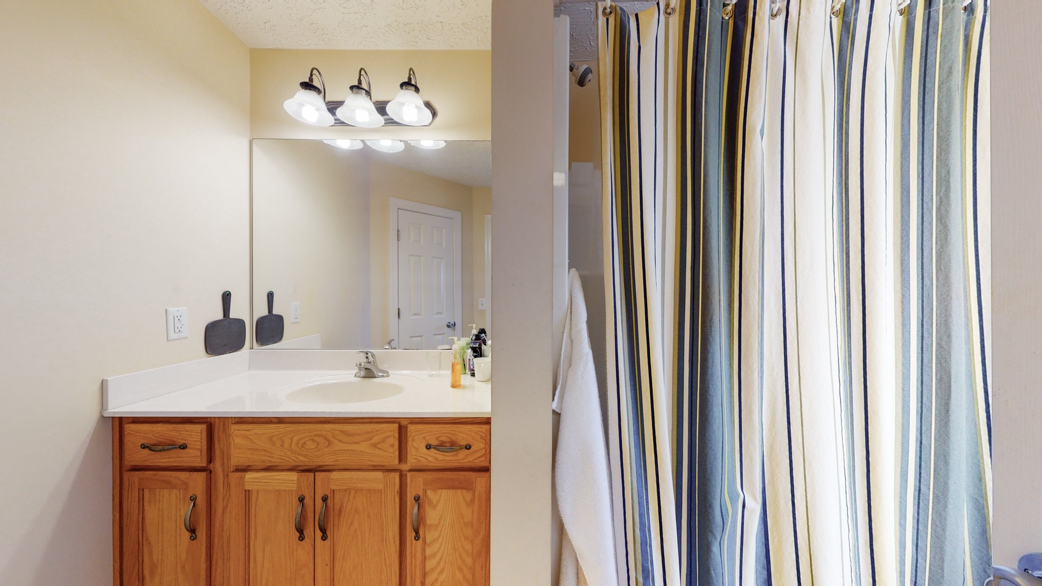 2996 South Rutland Road Mount Juliet, TN 37122 - Photo 31 of 37 a bathroom with a sink and a mirror