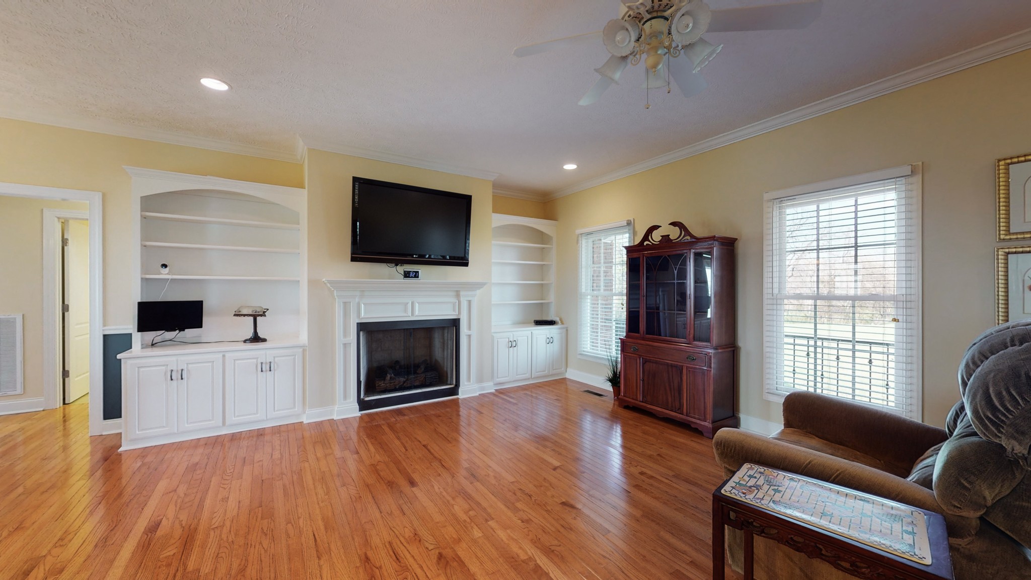 2996 South Rutland Road Mount Juliet, TN 37122 - Photo 8 of 37 a living room with furniture fireplace and flat screen tv