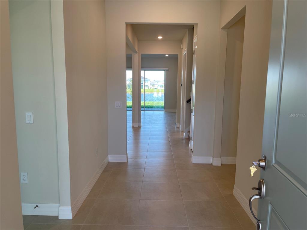 8375 Fenton Street Orlando, FL 32836 - Photo 3 of 29 a view of a hallway with wooden floor