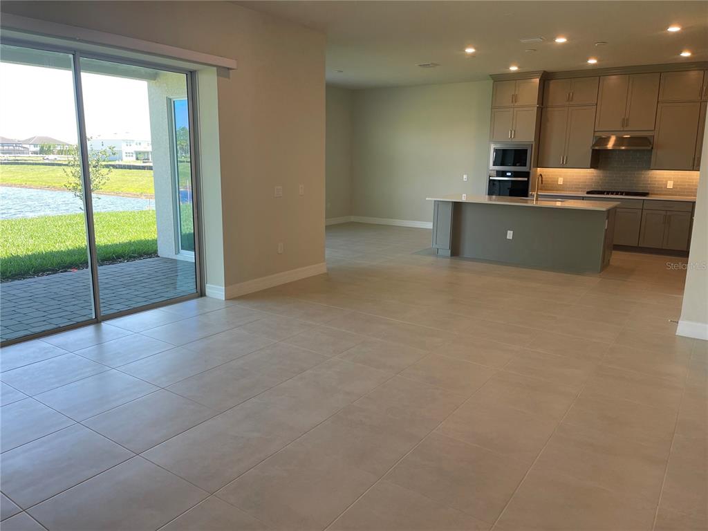 8375 Fenton Street Orlando, FL 32836 - Photo 5 of 29 a view of a kitchen with a sink and a refrigerator