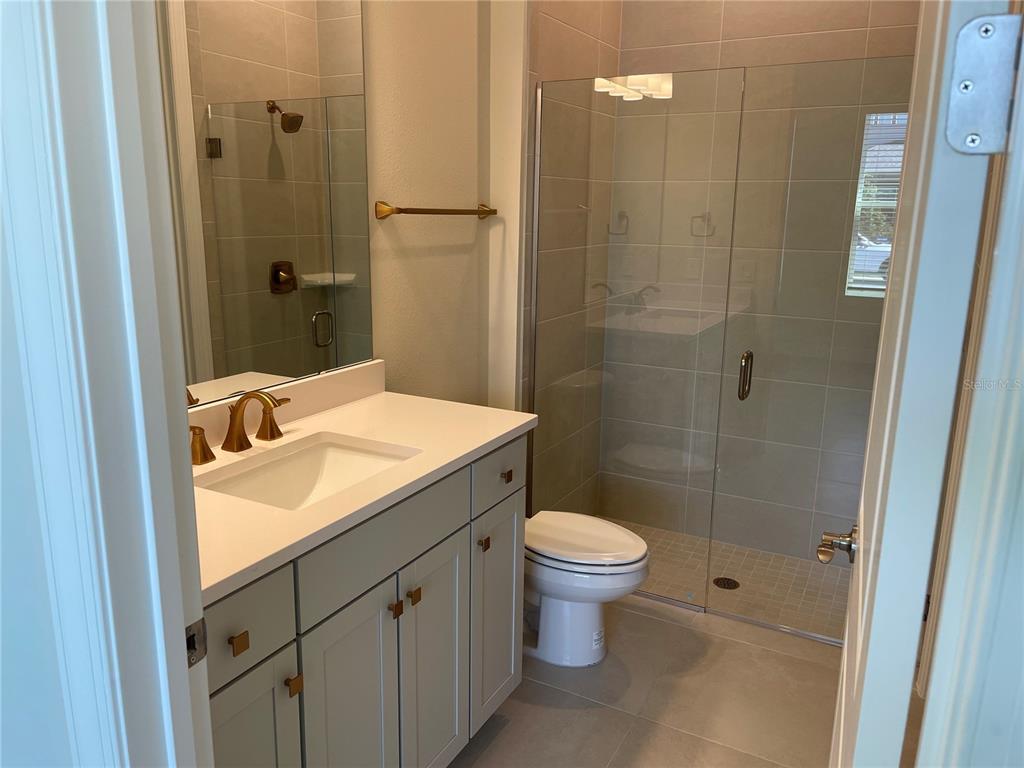 8375 Fenton Street Orlando, FL 32836 - Photo 10 of 29 a bathroom with a sink a toilet and shower