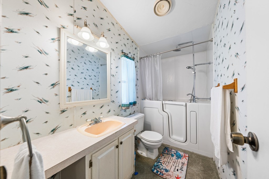 3526 Stapp Ranch Road Harper, TX 78631 - Photo 12 of 30 a bathroom with a sink toilet and shower