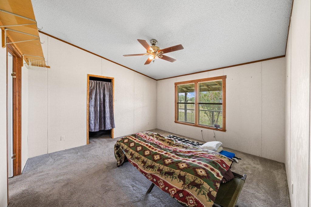 3526 Stapp Ranch Road Harper, TX 78631 - Photo 13 of 30 a bedroom with a bed and a window