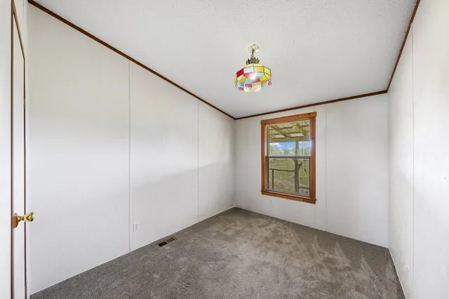 a utility room with a shower and a sink