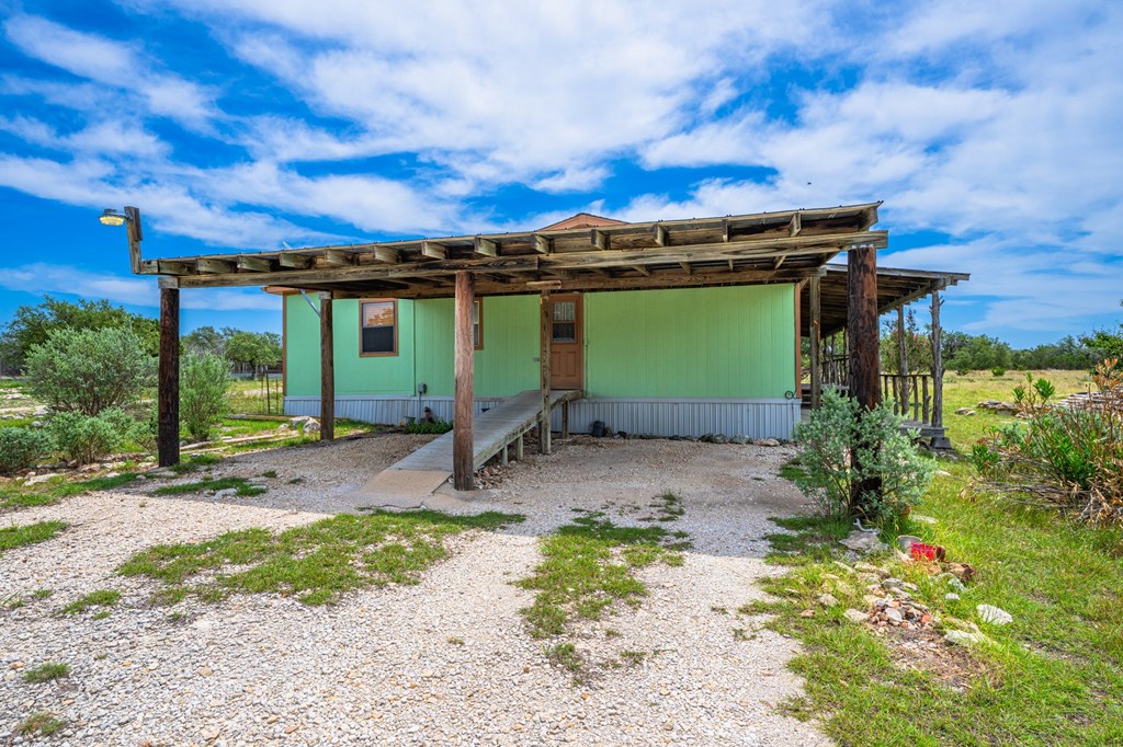 3526 Stapp Ranch Road Harper, TX 78631 - Photo 21 of 30 a view of a house with a patio