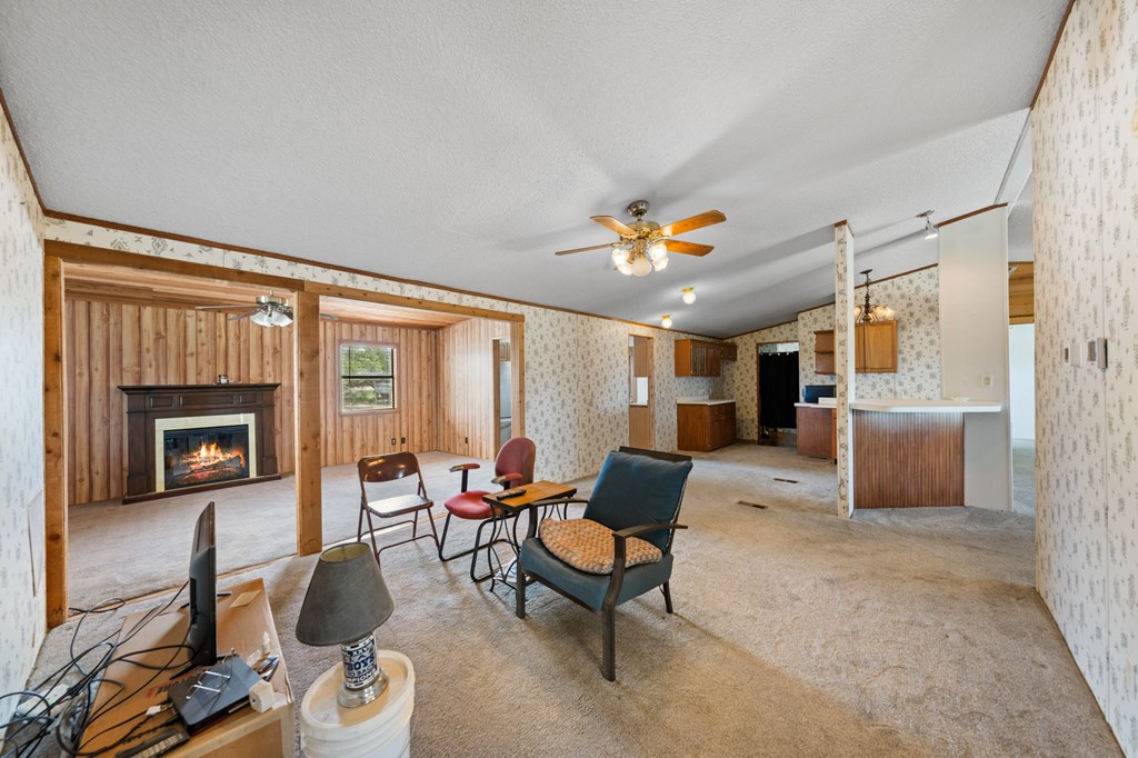 3526 Stapp Ranch Road Harper, TX 78631 - Photo 7 of 30 a living room with furniture and a fireplace