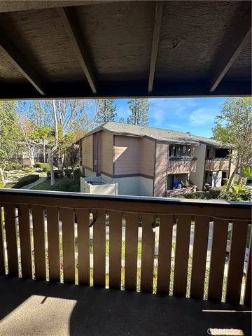 a wooden deck with table and chairs