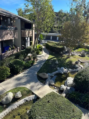 a backyard of a house with yard and outdoor seating