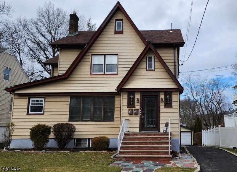 46 Cumberland Avenue, Unit 2 Verona, NJ 07044 - Photo 1 of 25 a front view of a house with a garden