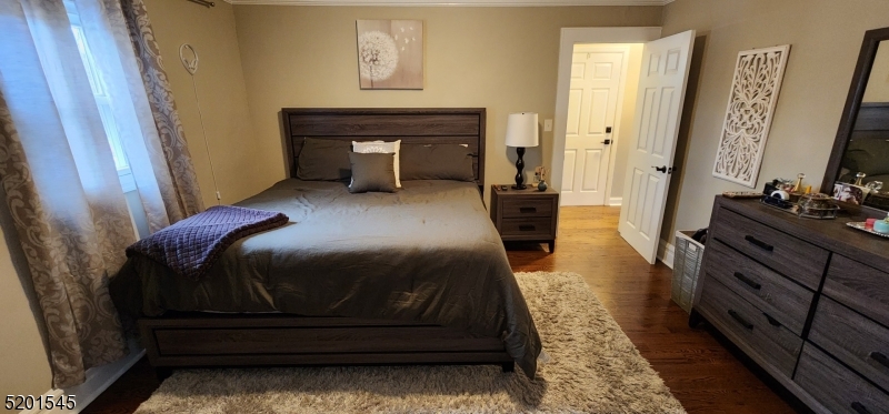 46 Cumberland Avenue, Unit 2 Verona, NJ 07044 - Photo 11 of 25 a bedroom with a bed and a dresser