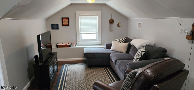 46 Cumberland Avenue, Unit 2 Verona, NJ 07044 - Photo 15 of 25 a living room with furniture and a window