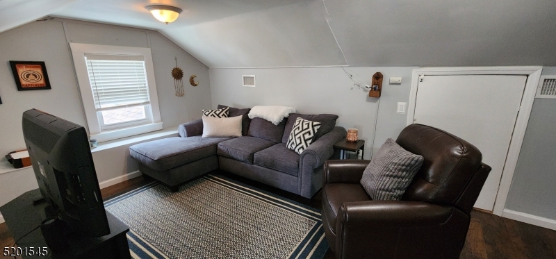 46 Cumberland Avenue, Unit 2 Verona, NJ 07044 - Photo 18 of 25 a living room with furniture and a window