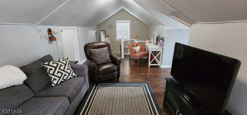 46 Cumberland Avenue, Unit 2 Verona, NJ 07044 - Photo 19 of 25 a living room with furniture and a flat screen tv