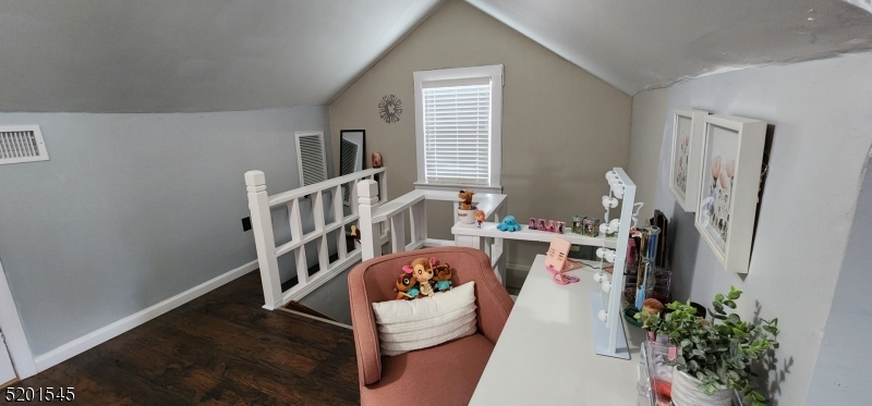 46 Cumberland Avenue, Unit 2 Verona, NJ 07044 - Photo 20 of 25 a living room with furniture and a chandelier