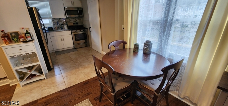 46 Cumberland Avenue, Unit 2 Verona, NJ 07044 - Photo 4 of 25 a dining room with furniture and window