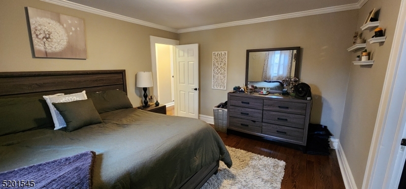 46 Cumberland Avenue, Unit 2 Verona, NJ 07044 - Photo 9 of 25 a bedroom with a bed and wooden floor