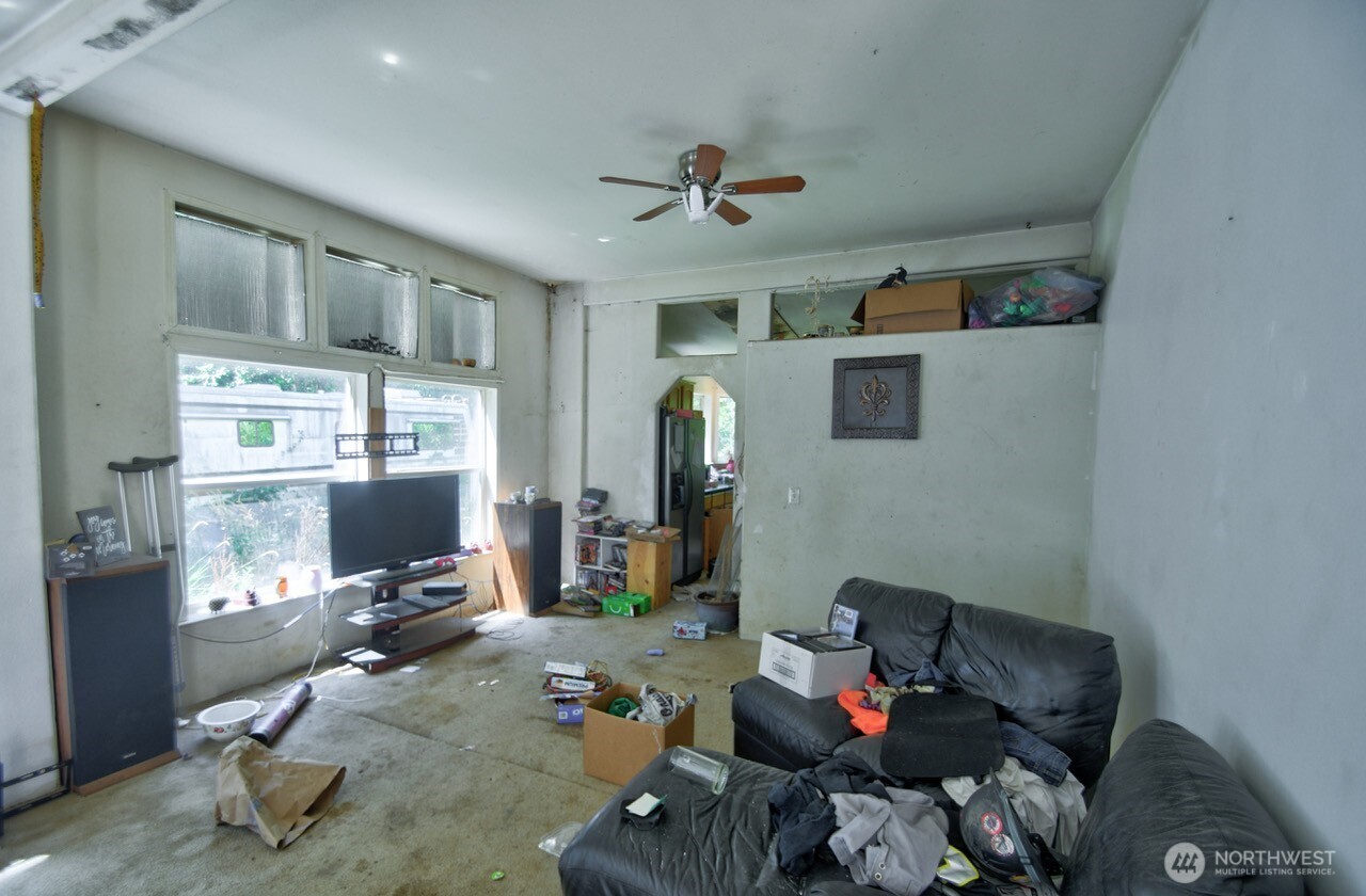 305 August Road, Unit 75 Onalaska, WA 98570 - Photo 17 of 21 a living room with furniture and a flat screen tv