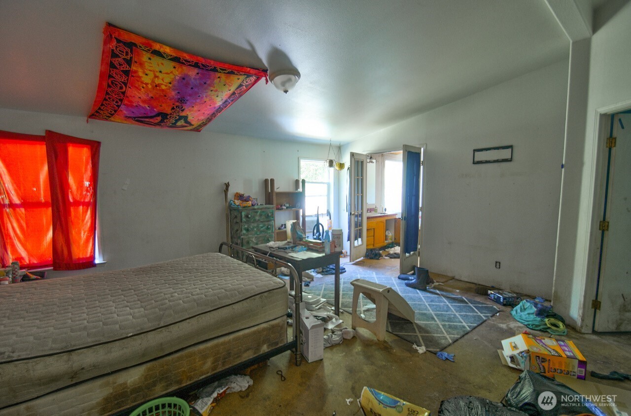 305 August Road, Unit 75 Onalaska, WA 98570 - Photo 20 of 21 a bedroom with a bed a desk and chair