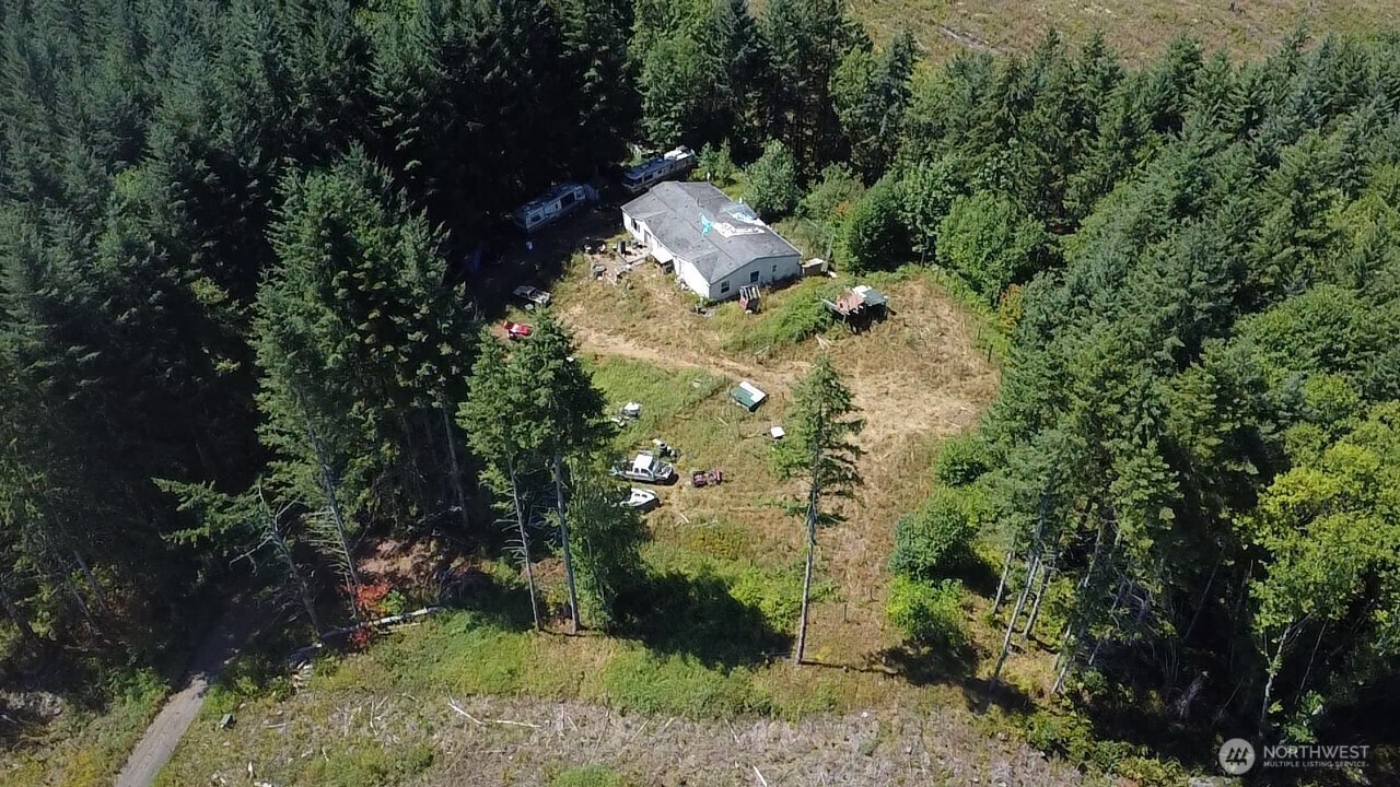 305 August Road, Unit 75 Onalaska, WA 98570 - Photo 9 of 21 a backyard of a house with a yard and outdoor seating