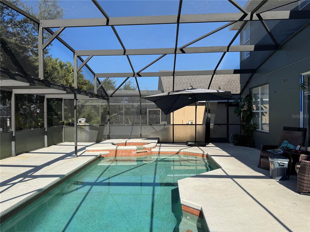 8449 Secret Key Cove Kissimmee, FL 34747 - Photo 2 of 3 a outdoor space with pool and furniture