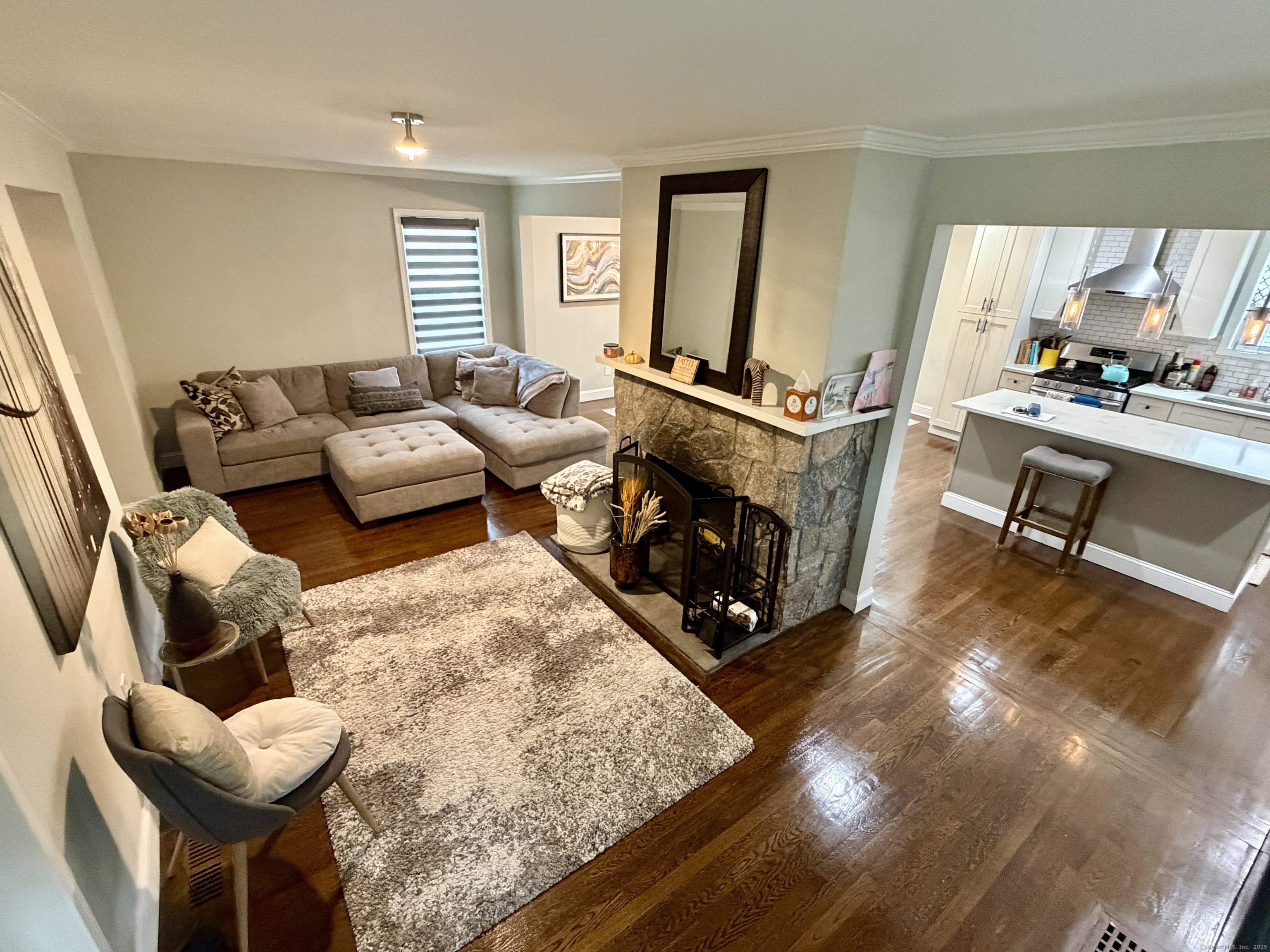 26 Grove Street Trumbull, CT 06611 - Photo 12 of 38 a living room with furniture and a fireplace