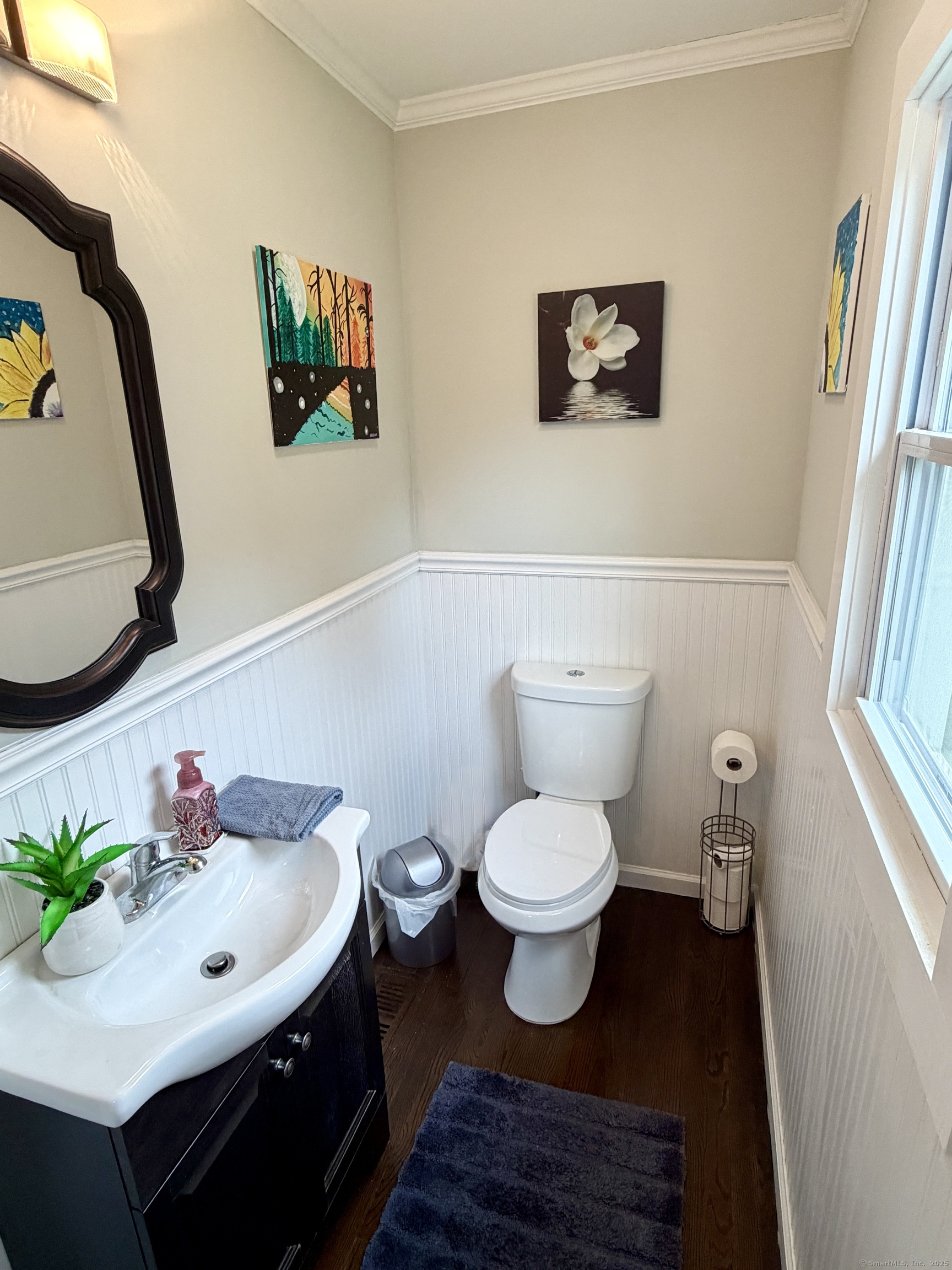 26 Grove Street Trumbull, CT 06611 - Photo 18 of 38 a bathroom with a toilet a sink and a mirror