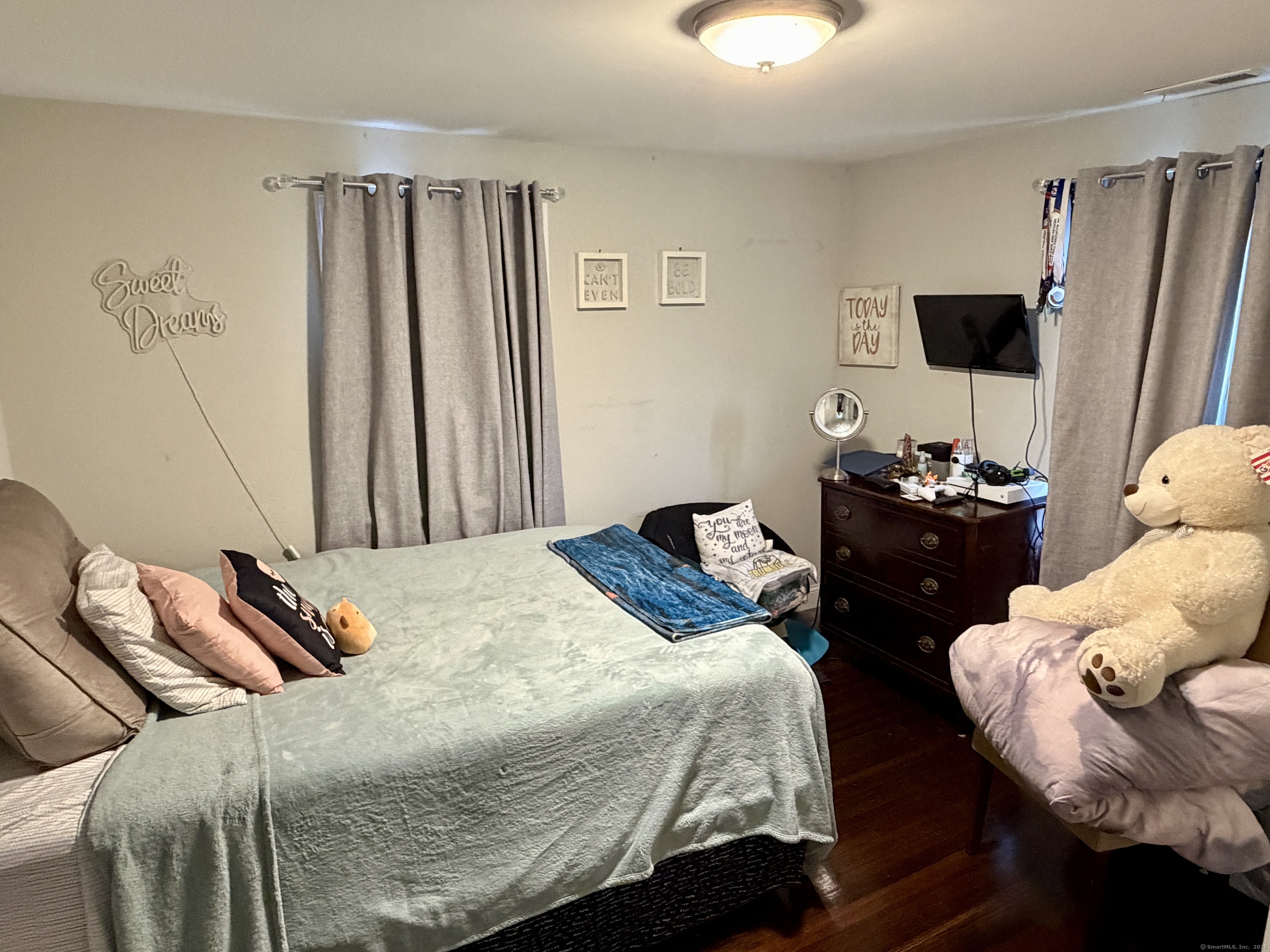 26 Grove Street Trumbull, CT 06611 - Photo 24 of 38 a bedroom with a bed and a window