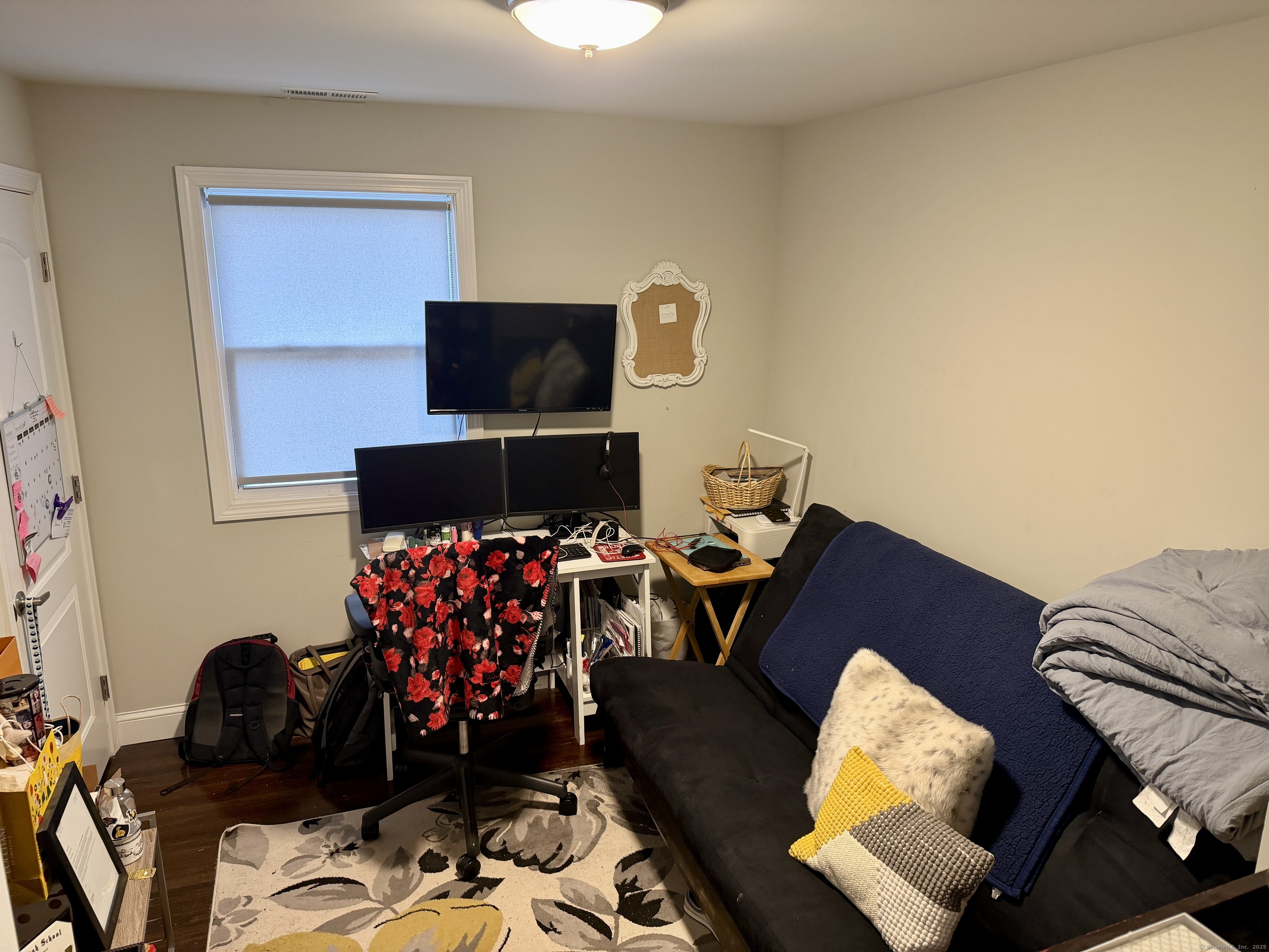26 Grove Street Trumbull, CT 06611 - Photo 25 of 38 a living room with furniture and a flat screen tv