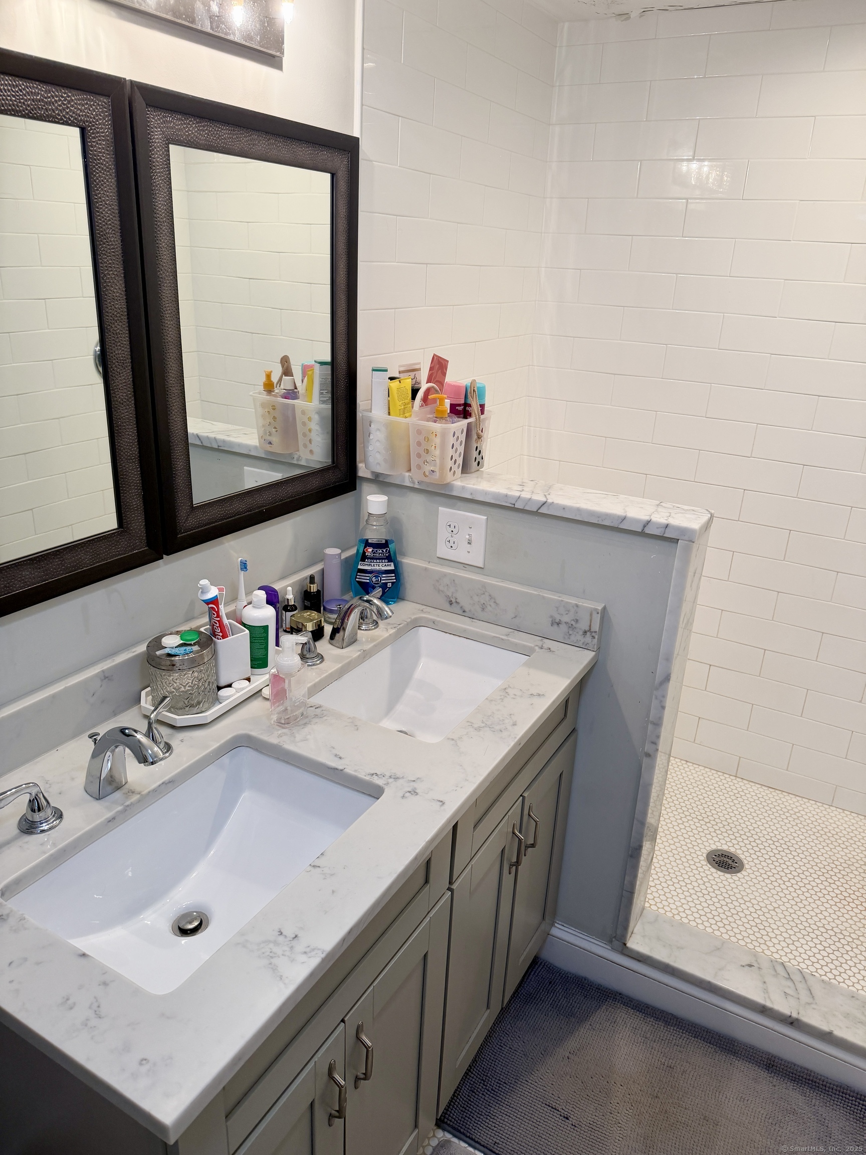 26 Grove Street Trumbull, CT 06611 - Photo 26 of 38 a bathroom with a sink vanity and a mirror