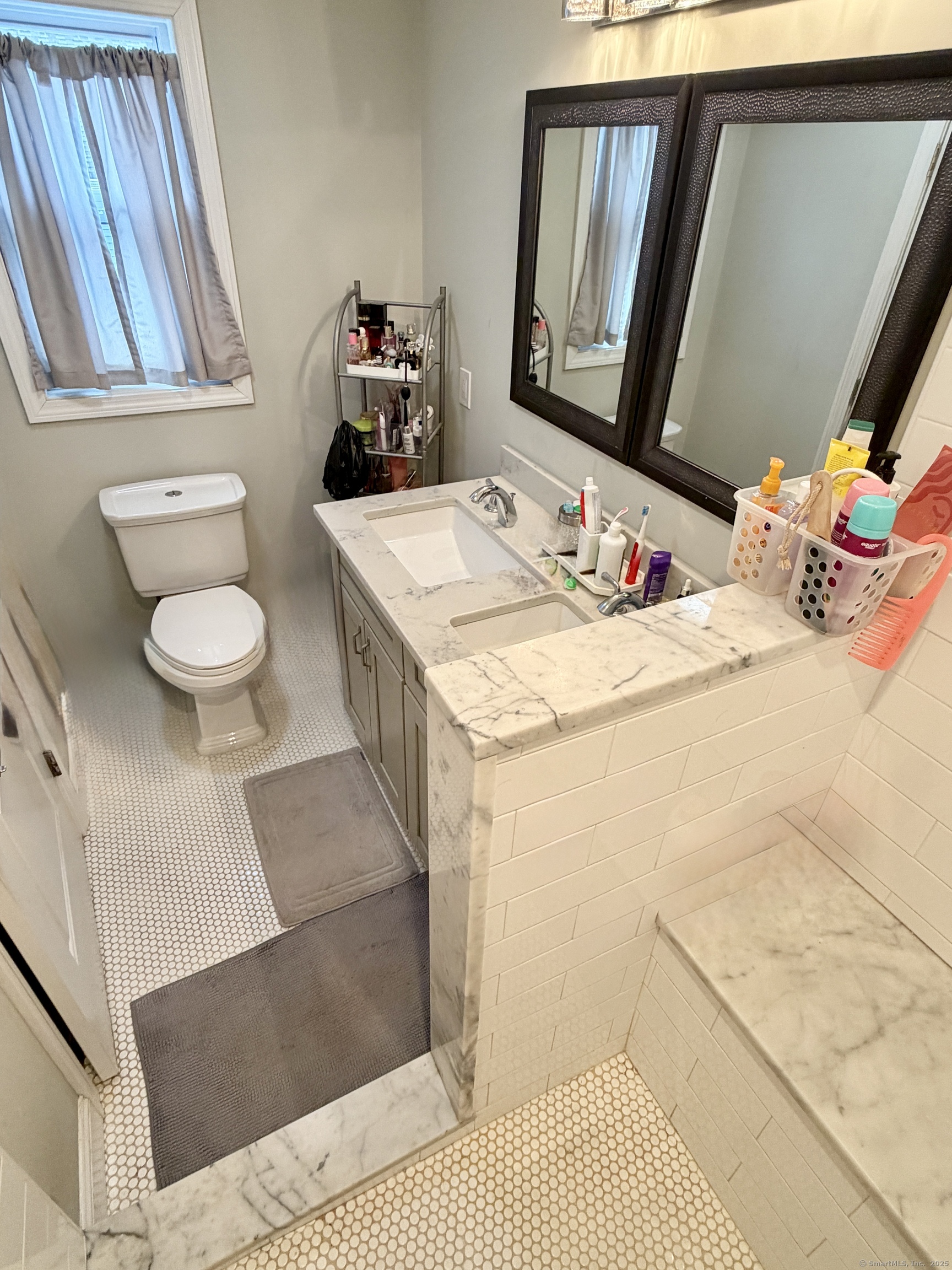 26 Grove Street Trumbull, CT 06611 - Photo 27 of 38 a bathroom with a sink toilet and mirror