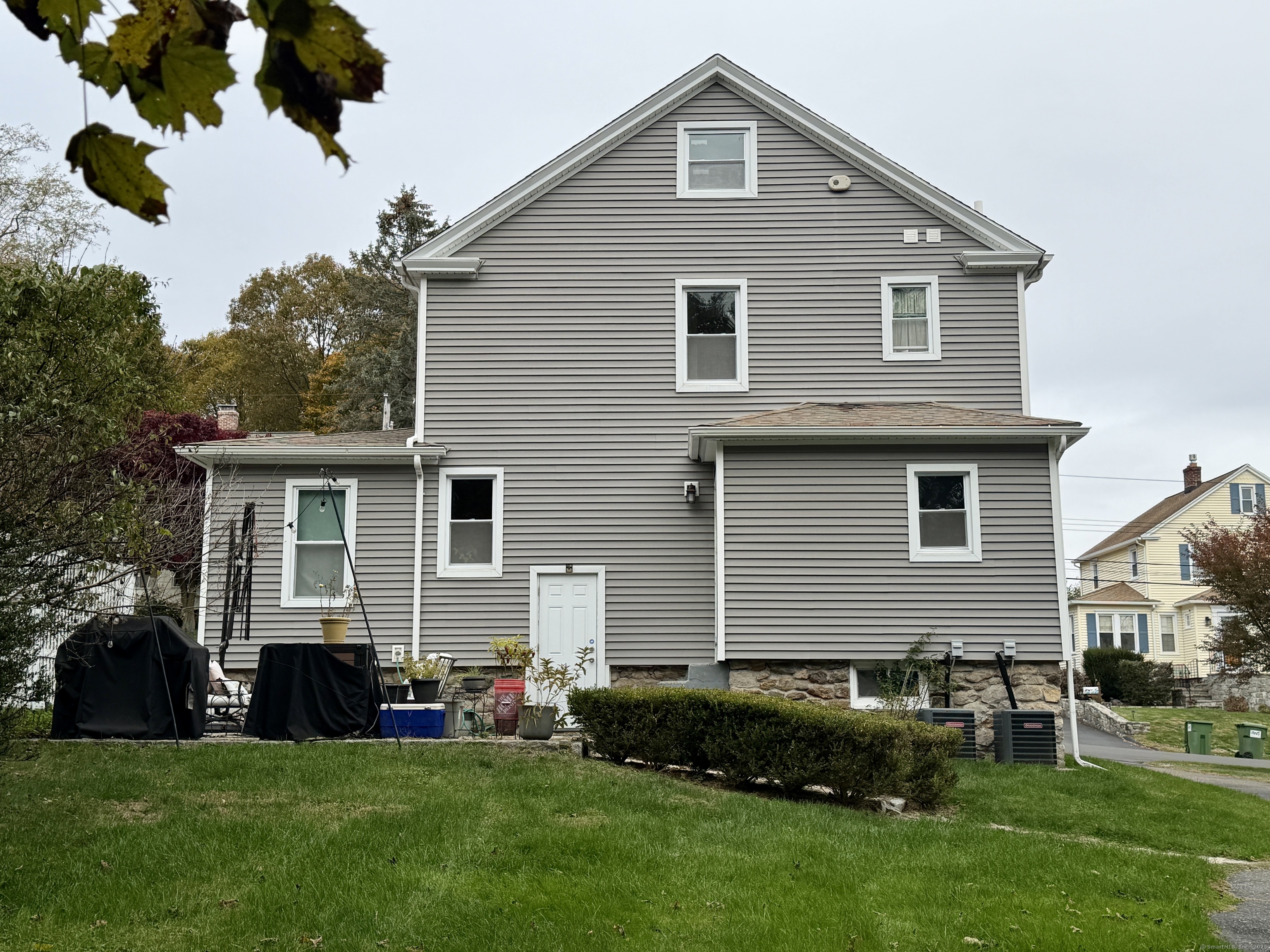 26 Grove Street Trumbull, CT 06611 - Photo 33 of 38 a front view of a house with a garden