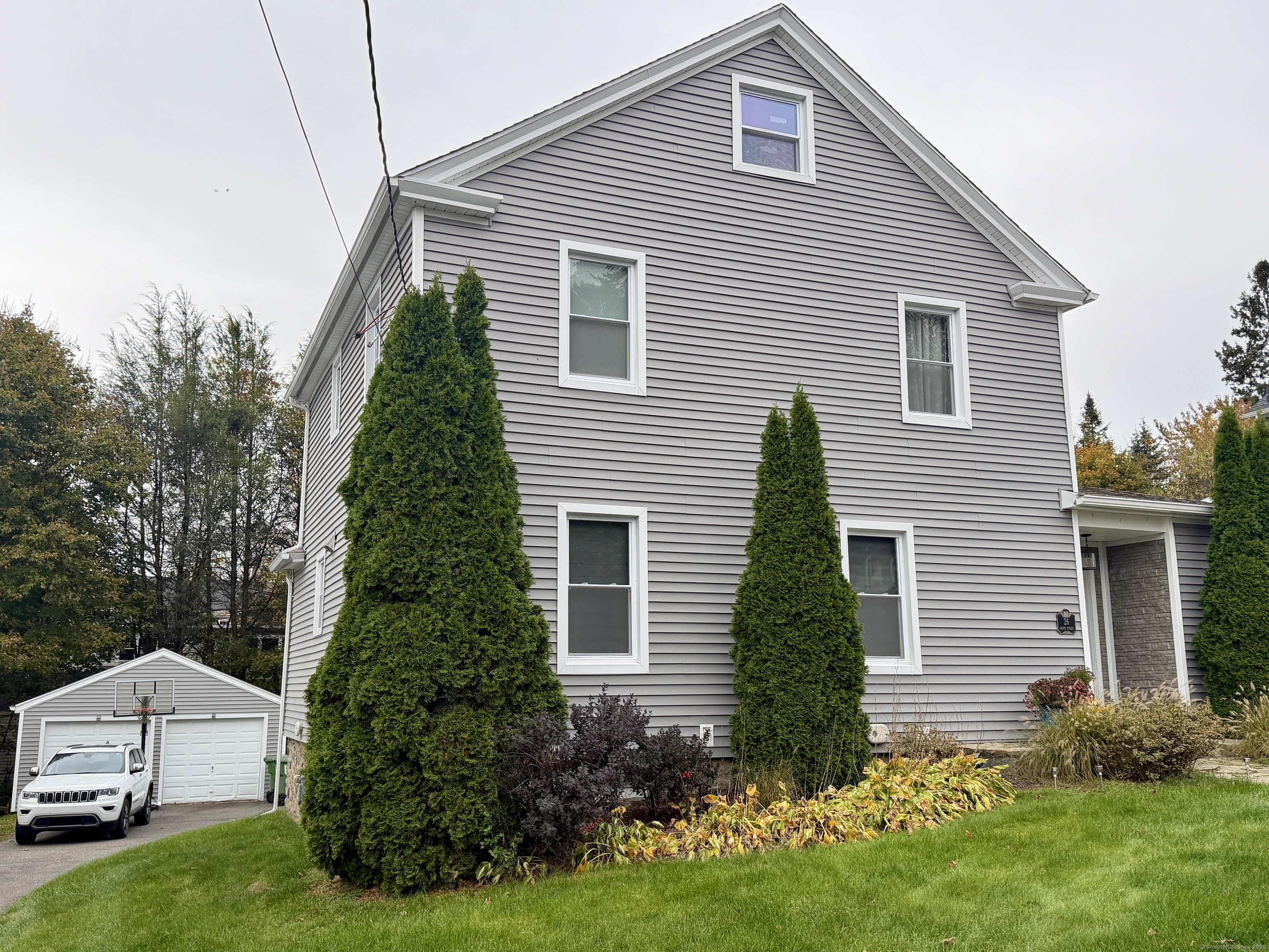 26 Grove Street Trumbull, CT 06611 - Photo 35 of 38 a view of a house with a yard and plants