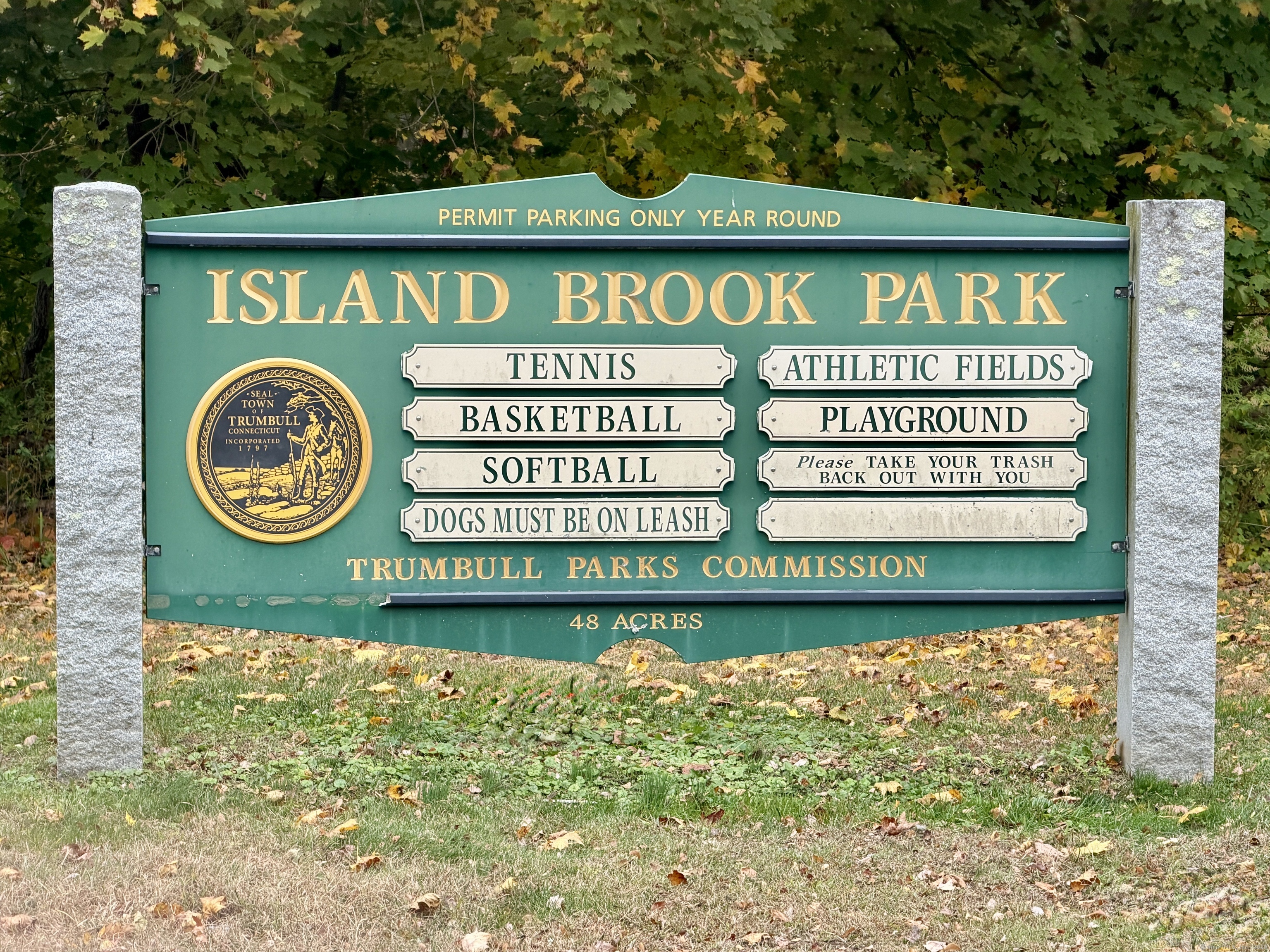 26 Grove Street Trumbull, CT 06611 - Photo 38 of 38 a sign that is sitting on a wooden wall