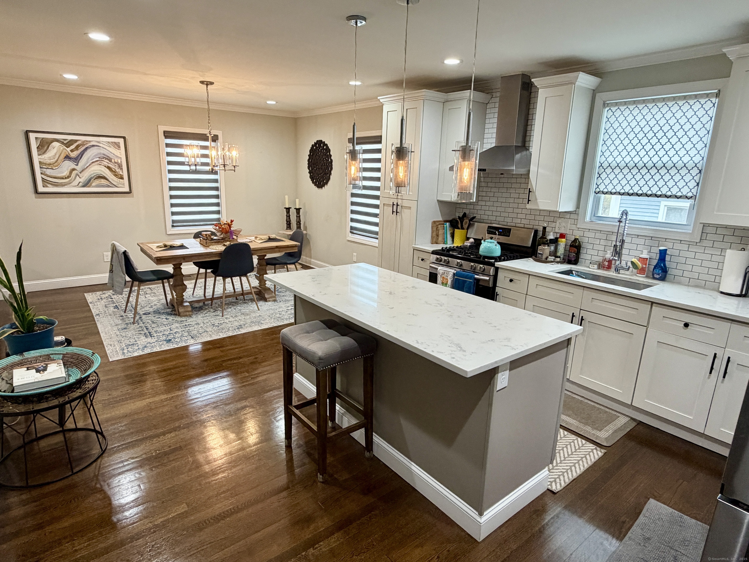 26 Grove Street Trumbull, CT 06611 - Photo 7 of 38 a kitchen with a stove a refrigerator and wooden floor