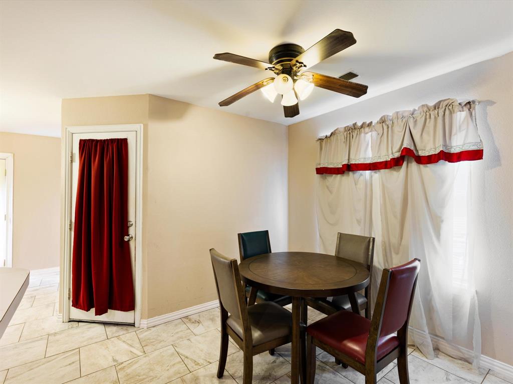 207 Quail Run Aubrey, TX 76227 - Photo 10 of 30 Dining space featuring baseboards and ceiling fan