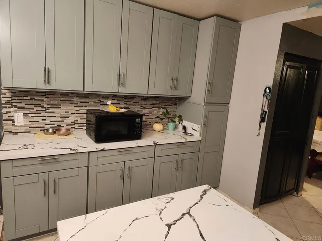 a kitchen with a sink and cabinets