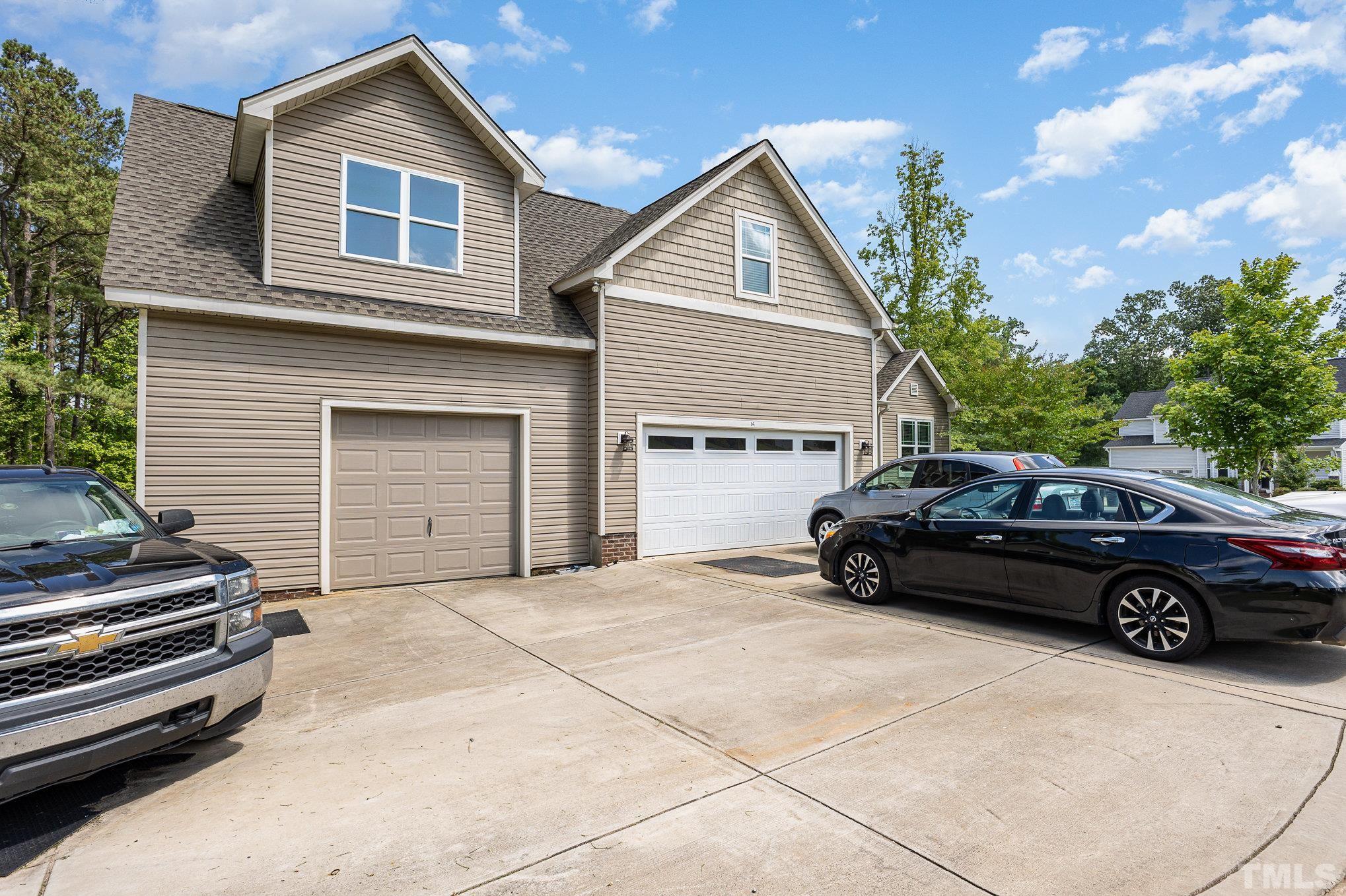 a view of a car parked in front of a house