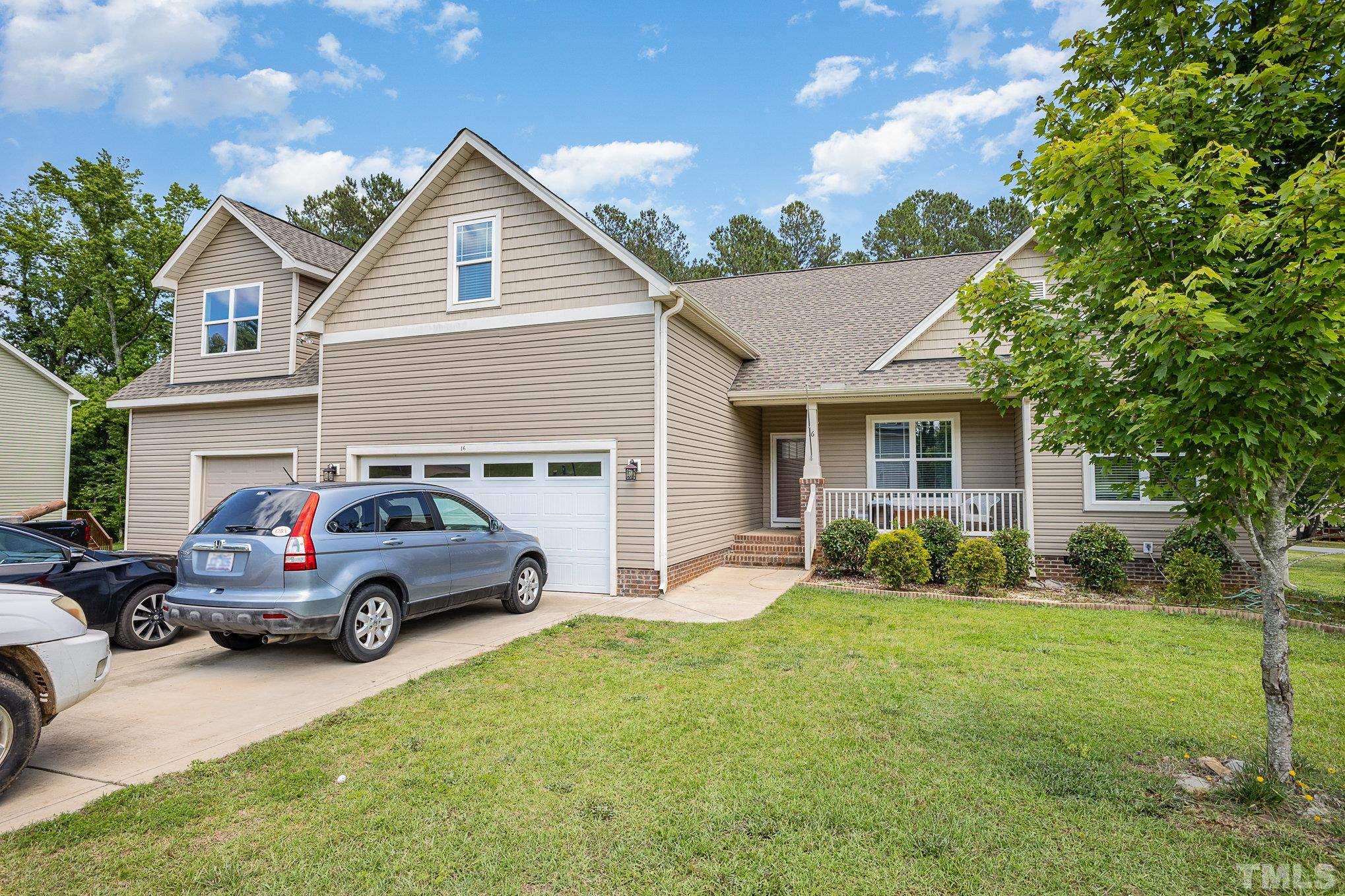 16 Chaparral Trail Garner, NC 27529 - Photo 2 of 29 a house view with a garden space