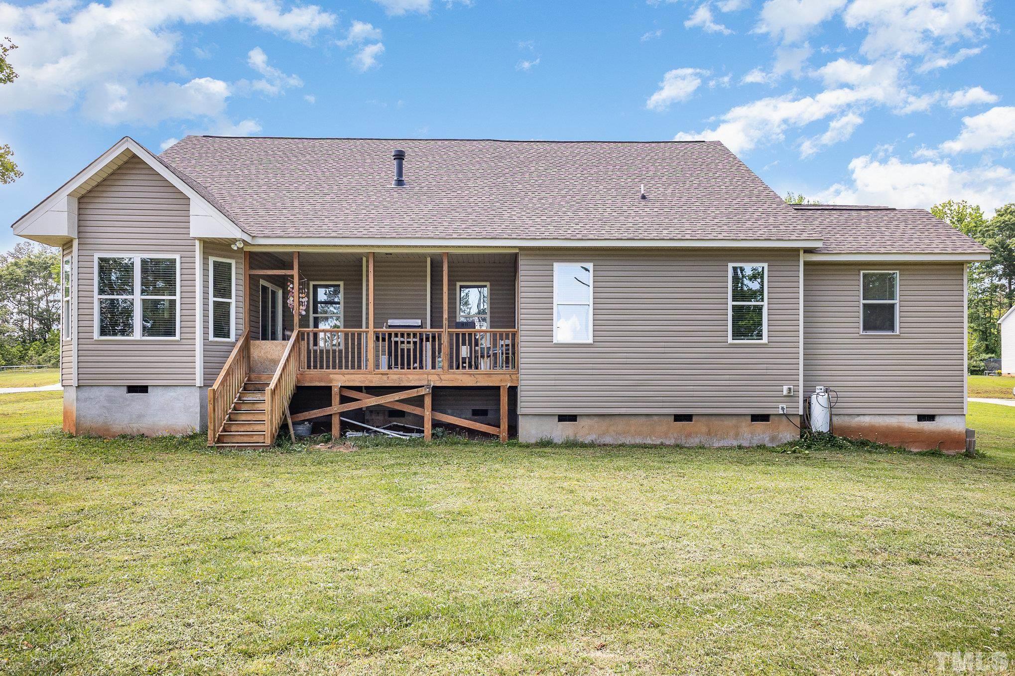 16 Chaparral Trail Garner, NC 27529 - Photo 27 of 29 a view of a house with a yard and sitting area