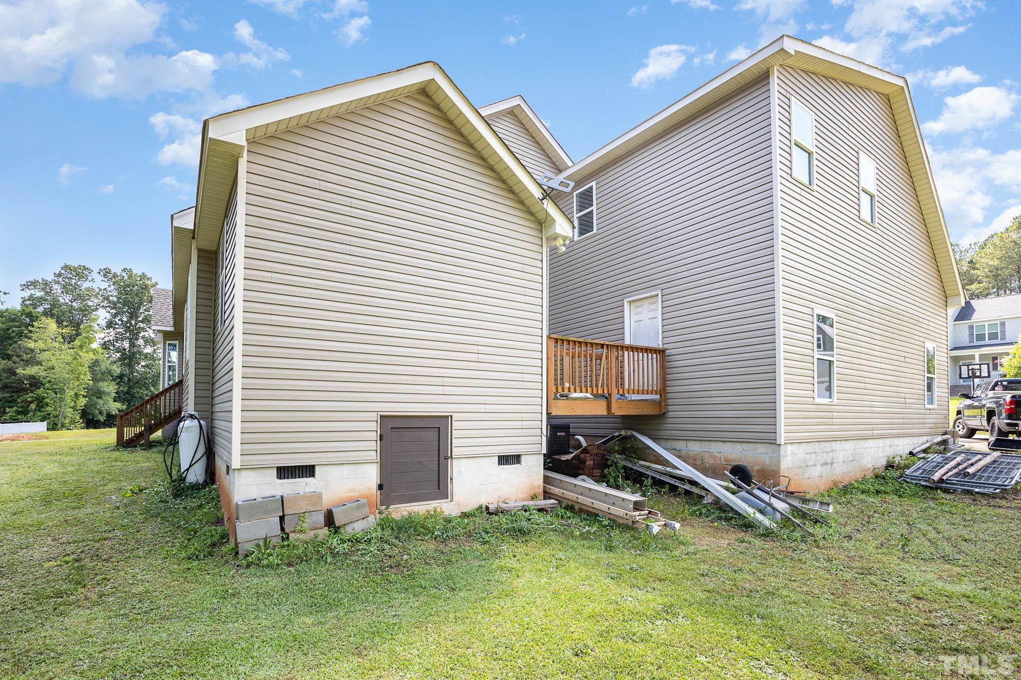 16 Chaparral Trail Garner, NC 27529 - Photo 29 of 29 a backyard of a house with table and chairs