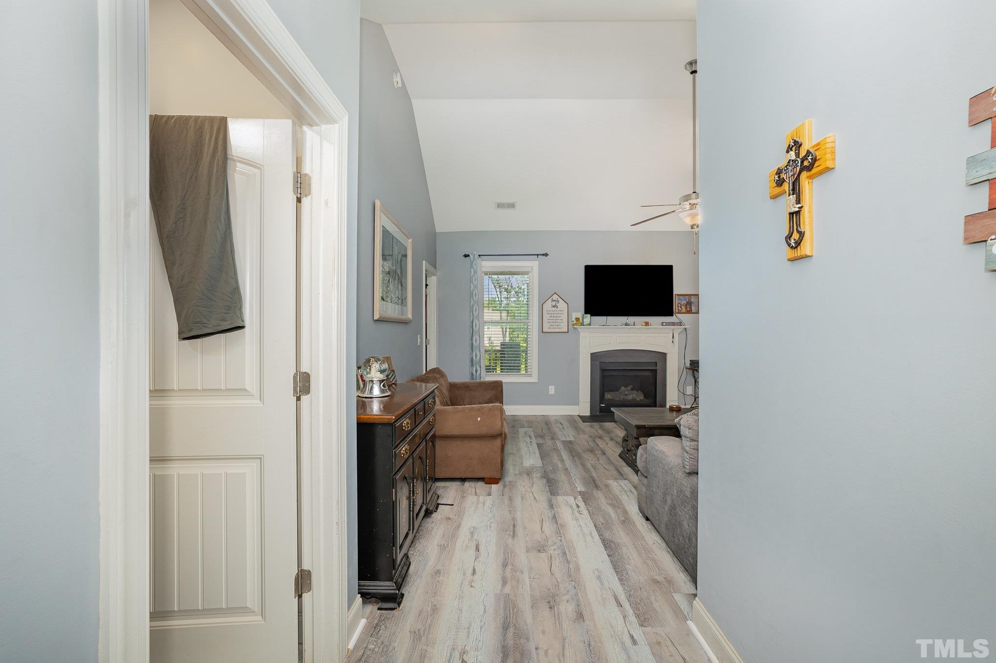16 Chaparral Trail Garner, NC 27529 - Photo 6 of 29 a view of a livingroom with furniture and a flat screen tv